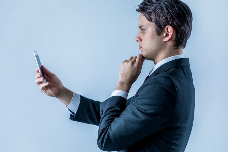 young businessman looking a smart phone