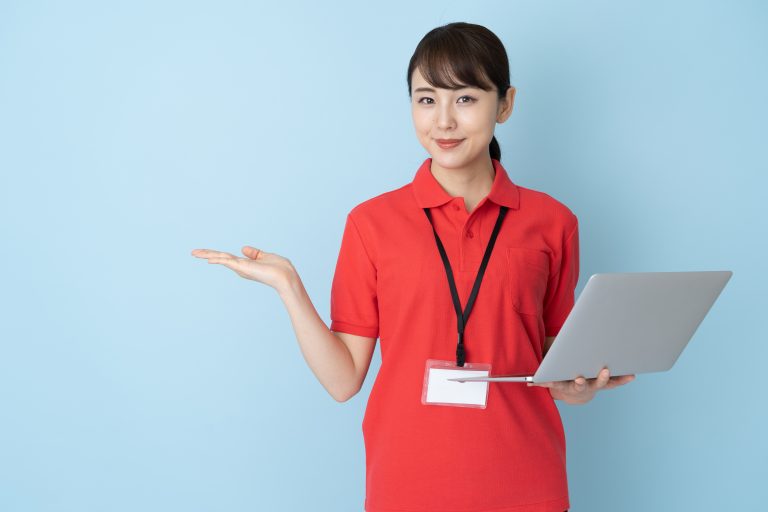 portrait of young asian woman wearing red polo shirts on blue background